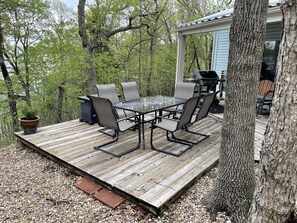 Fire the natural gas grill for dinner and light up the fire table 