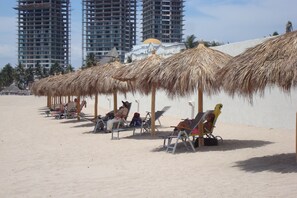 Beach club palapa's and lounge chairs