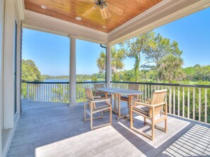 Covered Deck with Table and Chairs- Ceiling fan to help keep the breeze