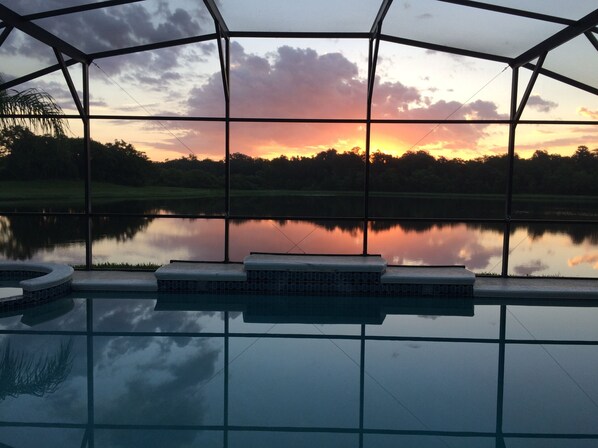 view of sunrise from bedroom, family room, kitchen and living room