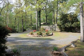 view from front porch, circular drive, privacy fence.