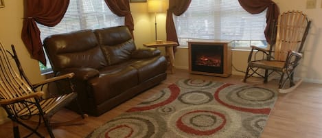 Living Room, Electric Fireplace heats room. Real leather recliner, Amish wood 