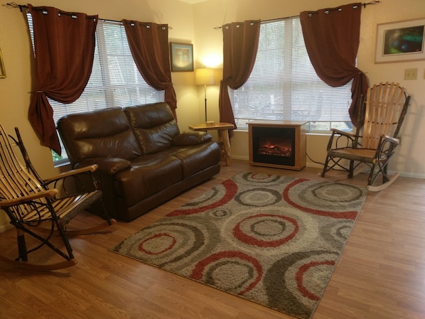 Living Room, Electric Fireplace heats room. Real leather recliner, Amish wood 