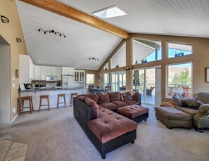 Open living room, dining room & kitchen w/a wall of windows & stunning views!