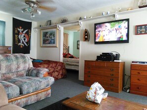 living room with new full and twin beds. TV and wiFi