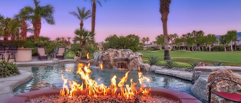 Enjoy your favorite beverage next to the custom firepit with golf course views!