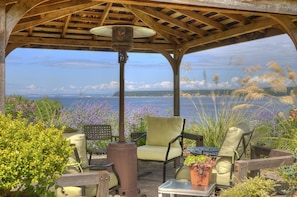 Relax in the gazebo with propane heater and four comfortable chairs.