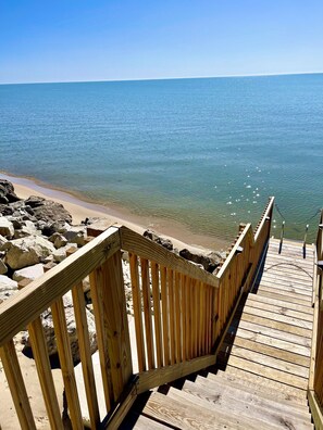 Finally a glimmer of beach. Stairs and ladder to the water. 6-2024.