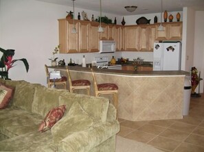 Kitchen with breakfast bar, loaded with the conveince of home.