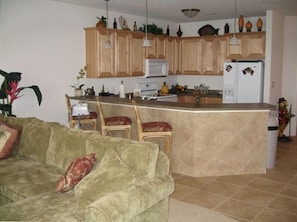 Kitchen with breakfast bar, loaded with the conveince of home.