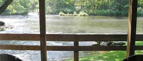 Relax on the covered deck and enjoy the rushing sounds of the river