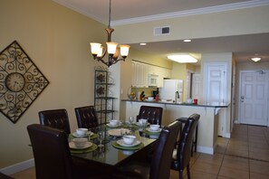 Dining room table for 6 with an additional 2 seats at the kitchen bar. 