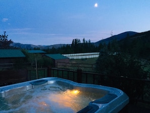 Shared hot tub on the back deck of the main home
