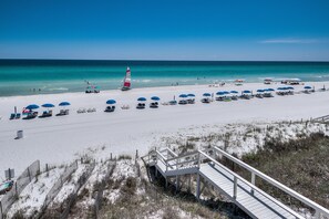 Six (6) Complimentary Beach Chairs with Umbrellas Set Up Daily