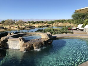 A very private pool oasis with a view of the lake and golf fairway!
