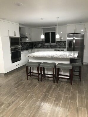 Fully stocked kitchen with plenty of space for a big family.