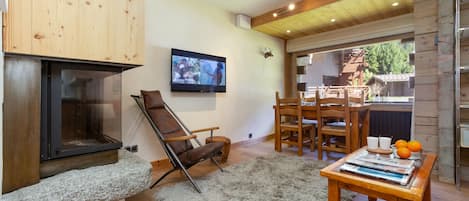 Homely living room with a log fire and HDTV