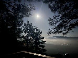 View of the moon above the clouds from the main deck