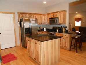 The kitchen opens to the dining room and living area.