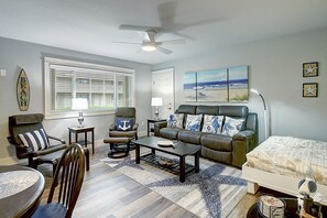 Living room with full size Murphy bed open - Comfortable seating for family gathering