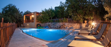 pool in the night overlooked form tour pergola with amazing views