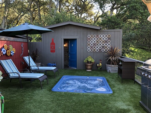 Beautiful Outdoor Deck with Hot Tub, Barbecue and Adjacent Outdoor Shower
