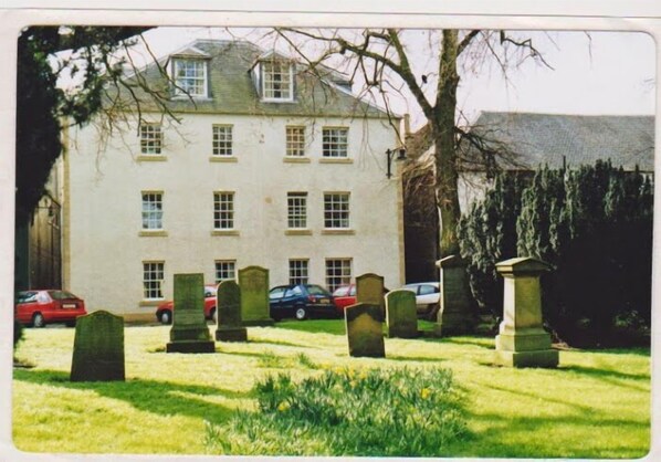 The two windows top left are the living room & main bedroom windows, below roof