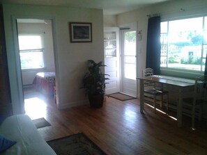 Spacious front room with natural hard wood floors