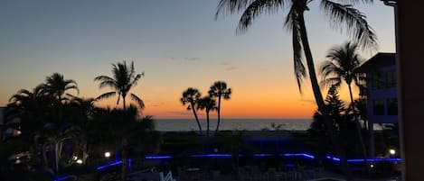 Sunset view overlooking resort’s common heated pool area  