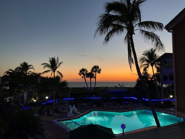 Sunset view overlooking resort’s common heated pool area  