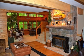 Hearth area flows to dining and living area with TV and stereo
