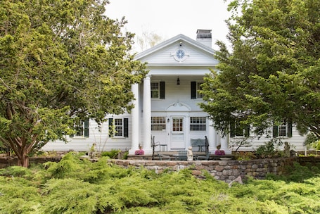 Eight gracious Ionic columns front our 1790 historic Sea Captain's Estate