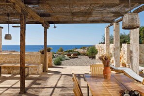 closed yard in front of the house with garden and seaview