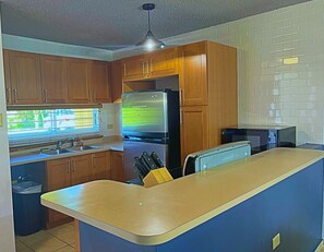 Equipped kitchen with all utensils and stainless steel appliances