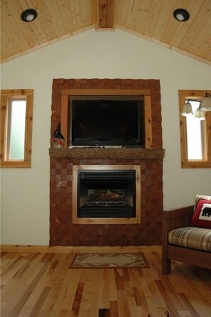 The fireplace is the focal point with its custom textured surface.