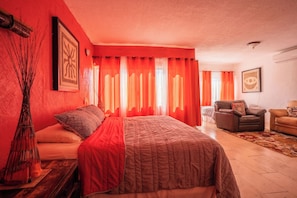 Spacious sun-themed master suite, ensuite bath, private living area, fiber arts