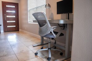 A height-adjustable desk and monitor are available in the main living room.