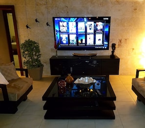 Enjoy the latest movies in the comfort of the grand villa living room