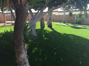 Jacuzzi and grassy space