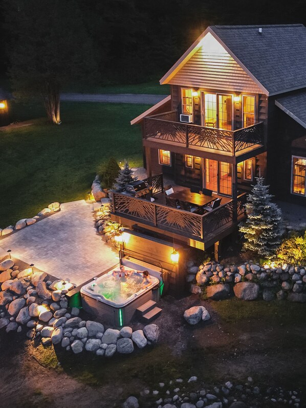 The backyard exterior, 6 person hot tub, and also a Weber grill &Master balcony