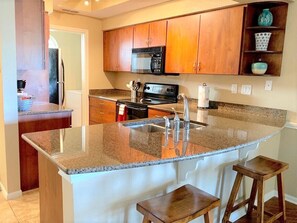 Kitchen and bar with granite counter tops