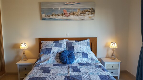 large kingsize bed with sliding doors on to the large balcony