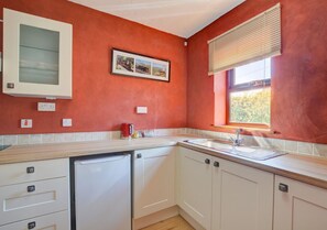 the open plan living area with spacious kitchen