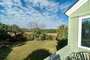There are 3 decks, all with peaceful views of the green marsh.