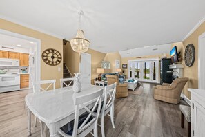 An open floor plan with dining and living area opening to one another