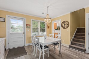 Upon entering through the front door, there is a great room area with the kitchen off to your left, guest bedrooms on your right, and the primary bedroom in the back.