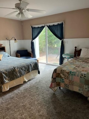 Head up a half flight of stairs to the 2nd BR. It has a queen bed & deck access.