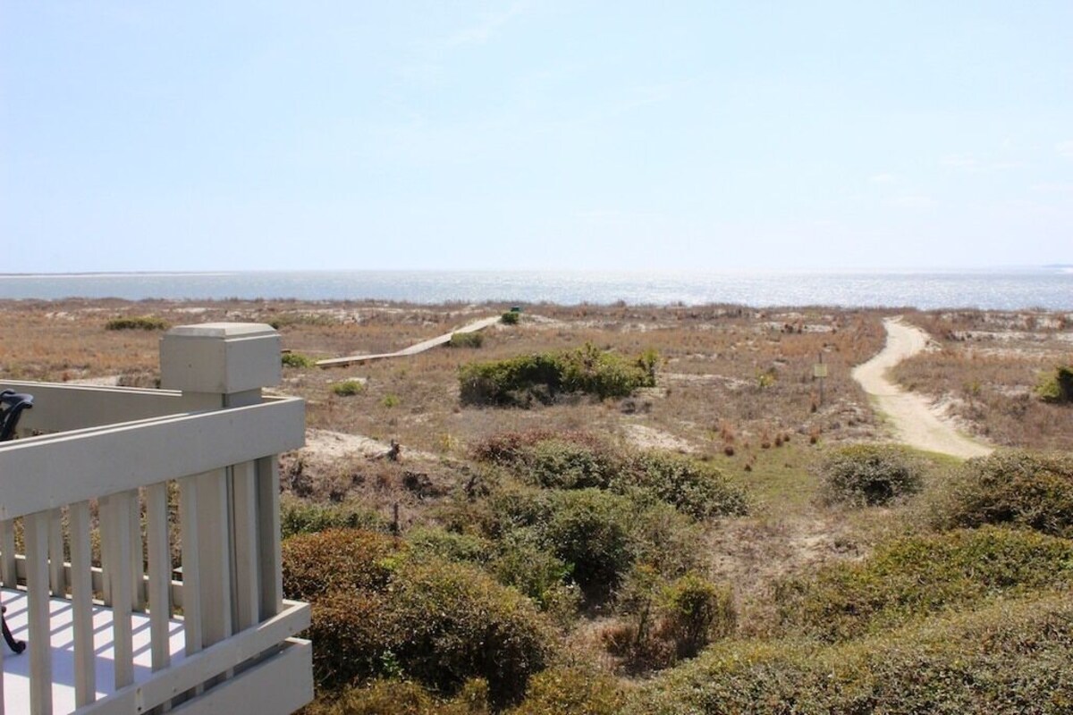 This professionally decorated & updated villa has views of the beach & ocean!