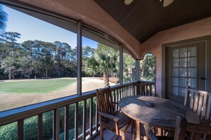 The screen porch off the living room has a table for dining