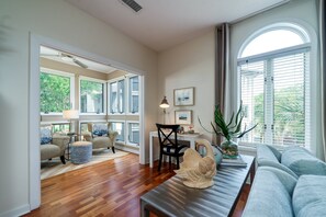 The great room opens to the sunroom. Nice work from home nook.